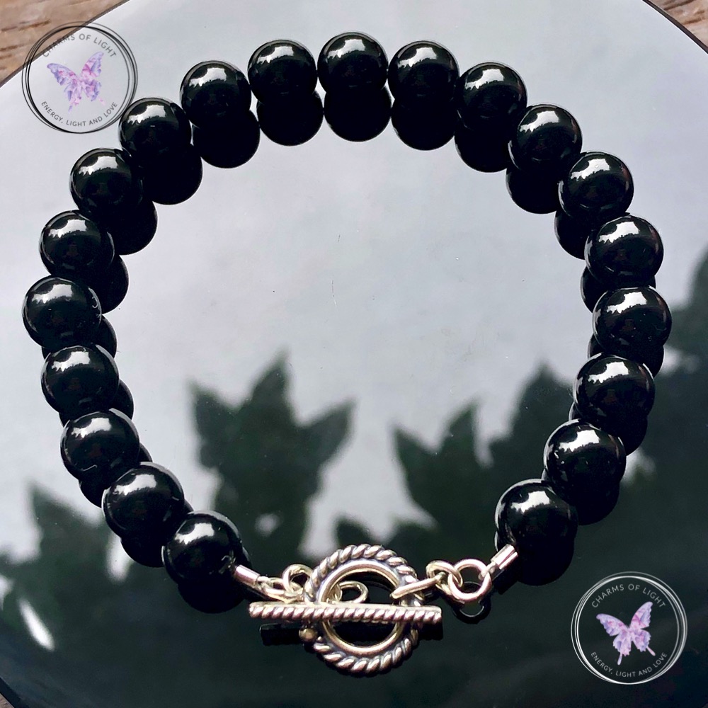 Black onyx charms of light store