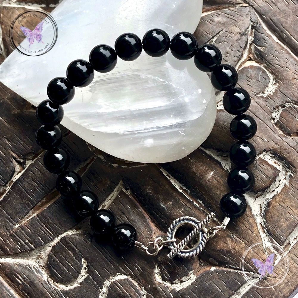 Black onyx charms of on sale light